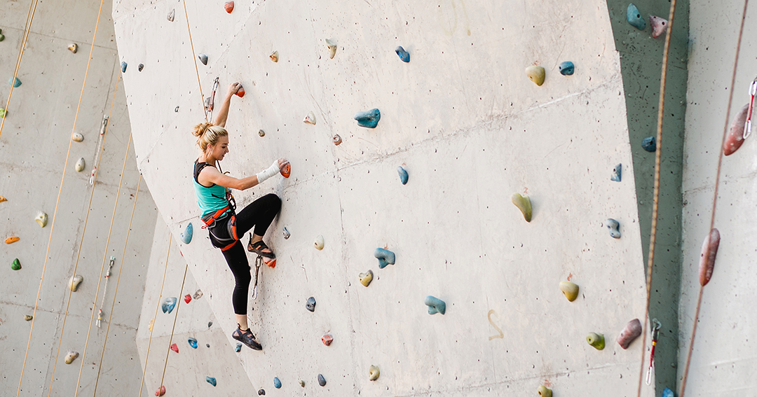 woman rock climbing